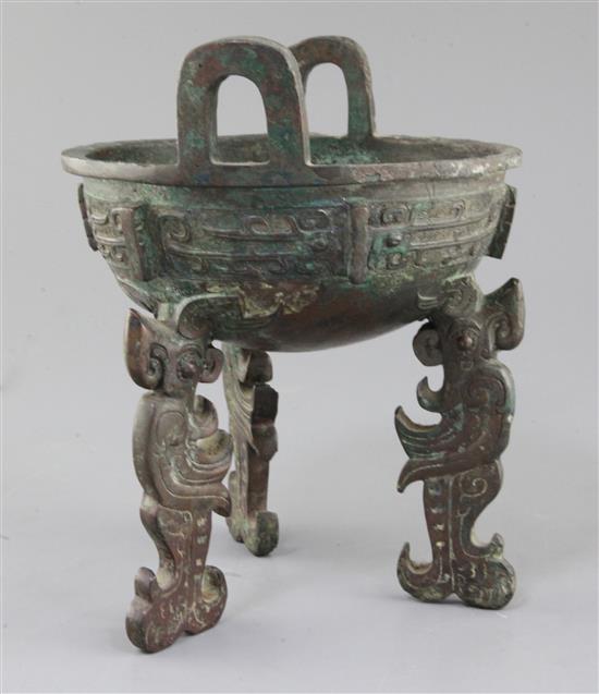 A Chinese archaic bronze tripod ritual food vessel, late Shang/early Western Zhou dynasty, 23cm high, repairs